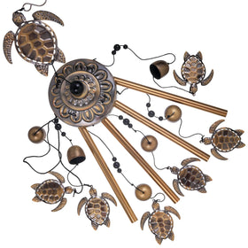 Solawindchime bronze sea turtle wind chime by window offers gentle, peaceful tones.