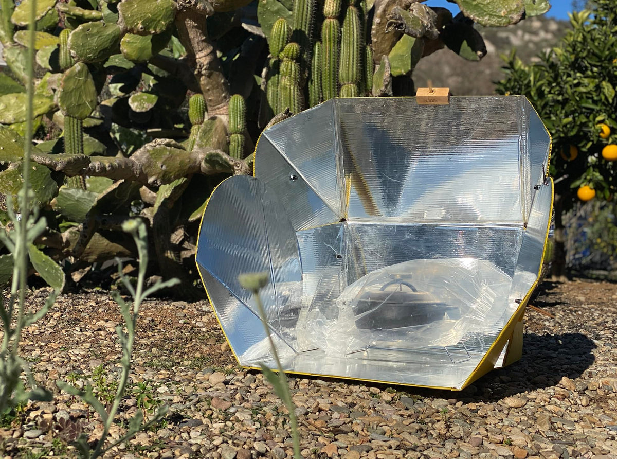 SolCook solar cooker folded in a compact portable form for camping.