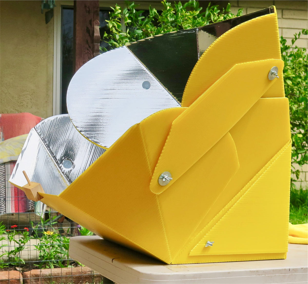 SolCook solar cooker folds into portable, space-saving storage.