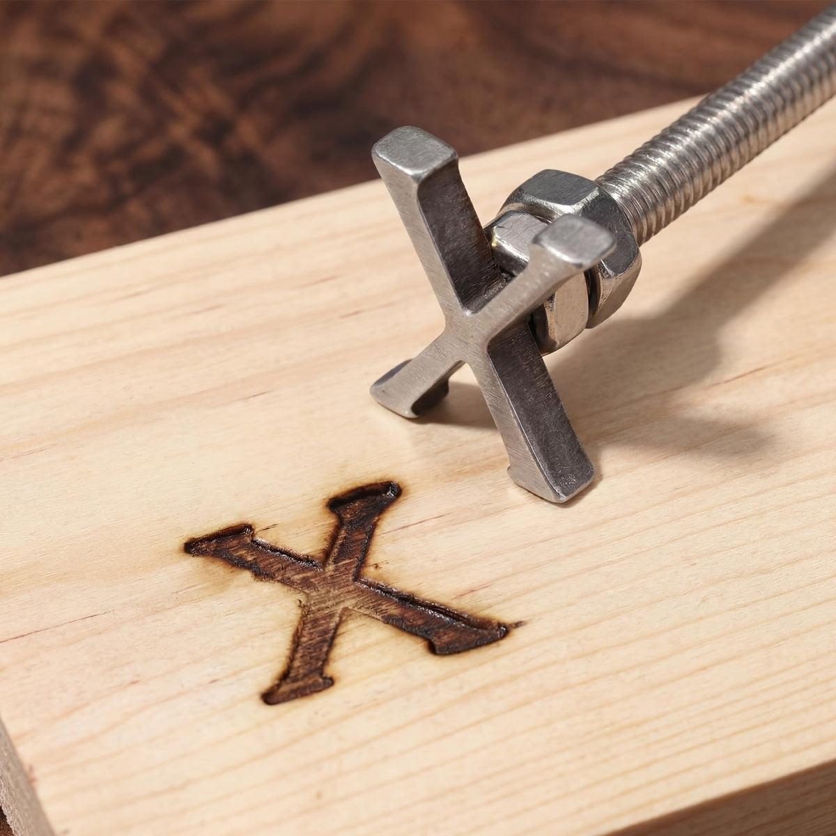 Sosation branding irons in use on bread for custom markings