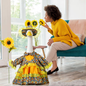 Soulchen sunflower ensemble on porch goose brightens garden ambiance.