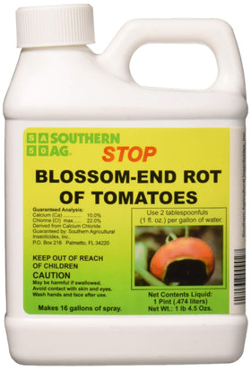 Southern Ag Stop Blossom-End Rot bottle beside tomato plant for calcium support.