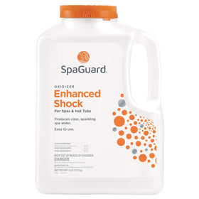 SpaGuard Enhanced Shock bottle pour demonstrating rapid 15-minute treatment.