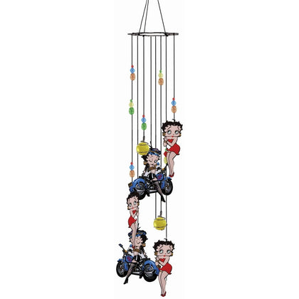 Spoontiques Betty Boop Biker Wind Chime hanging outdoors for whimsy and soft sound.