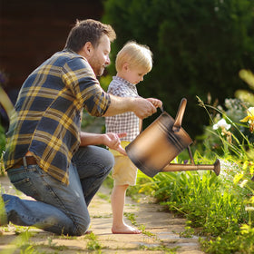 Sporgard dual-handle metal watering can for balanced indoor and outdoor watering.