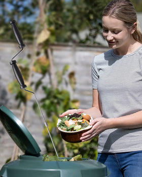 SQUEEZE master garden aeration tool for efficient compost mixing.