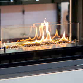 Stanbroil caramel luster drops spread across an outdoor fire bowl for drama