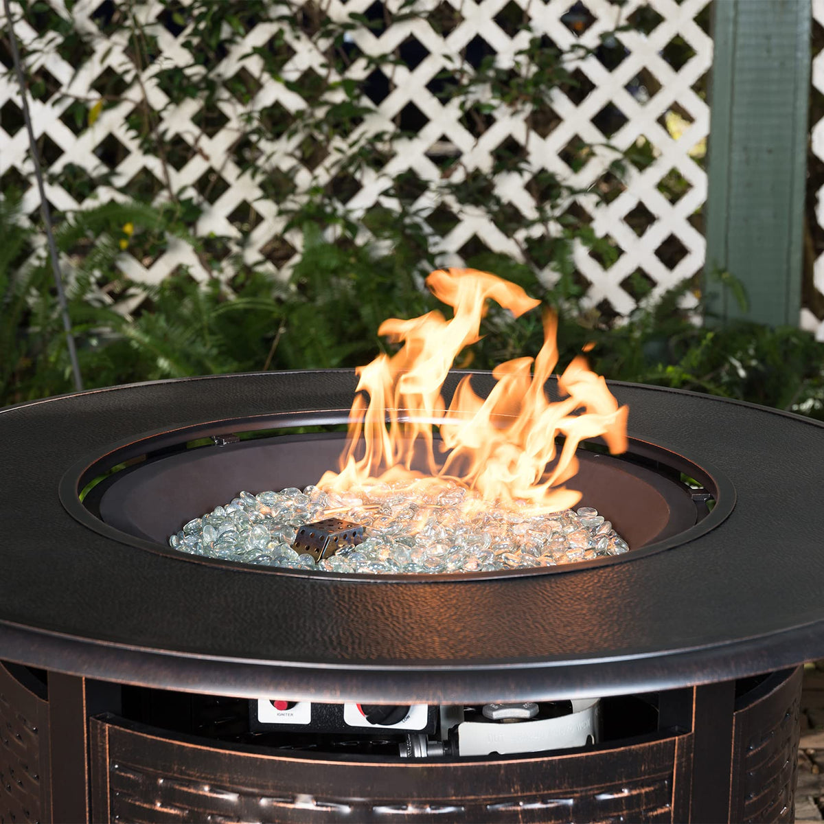Stanbroil crystal ice luster fire glass drops outdoor-fire-bowl setup enhances ambience with reflective sparkle.