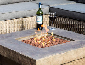Stanbroil lava rocks as a neutral base layer supports logs or glass.