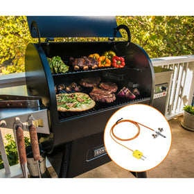 Stanbroil grill temperature sensor in use aiding cooking progress monitoring.