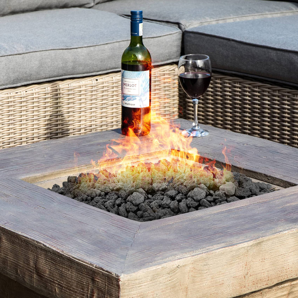 Stanbroil lava rock granules serve as a stable base layer before logs or glass.