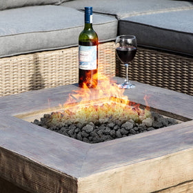 Stanbroil lava rock granules serve as a stable base layer before logs or glass.
