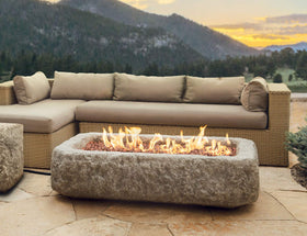 Stanbroil lava rock granules serve as a realistic base for gas logs indoors or outdoors.