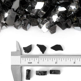 Stanbroil Onyx Black fire glass 1/4-inch tempered pieces arranged in a fireplace for modern style