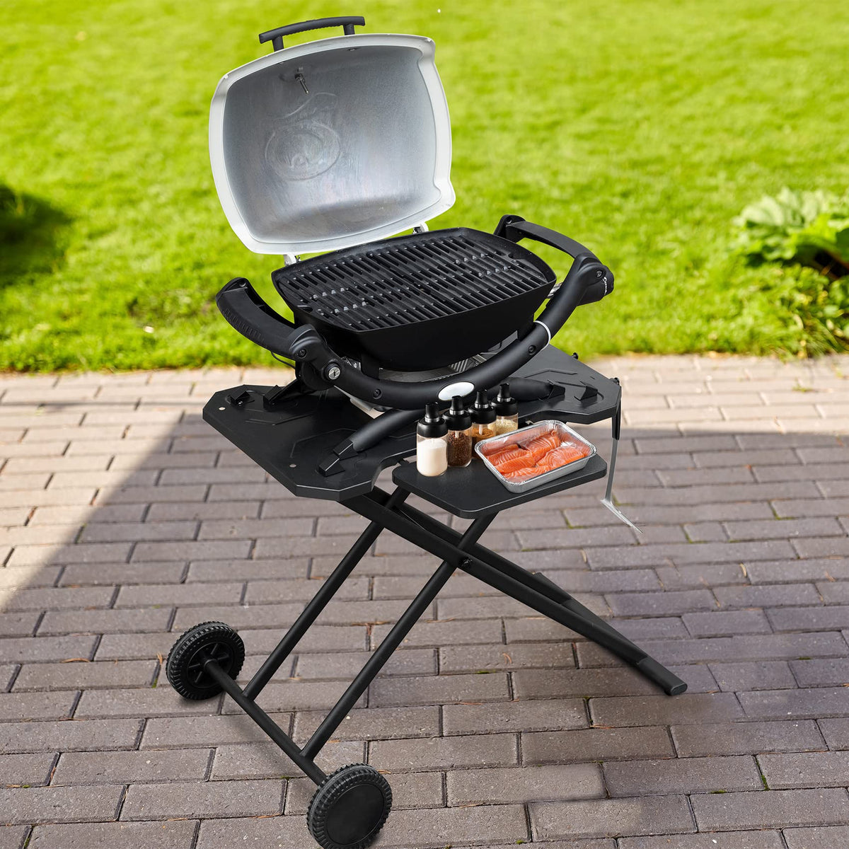 Stanbroil Weber Q cart on wheels for easy patio-to-camping transport.