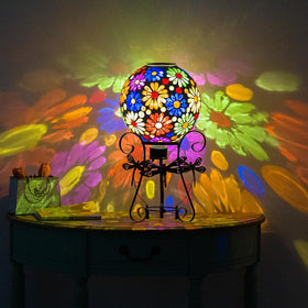 Starsoul garden globe with stand placed on lawn or steps.
