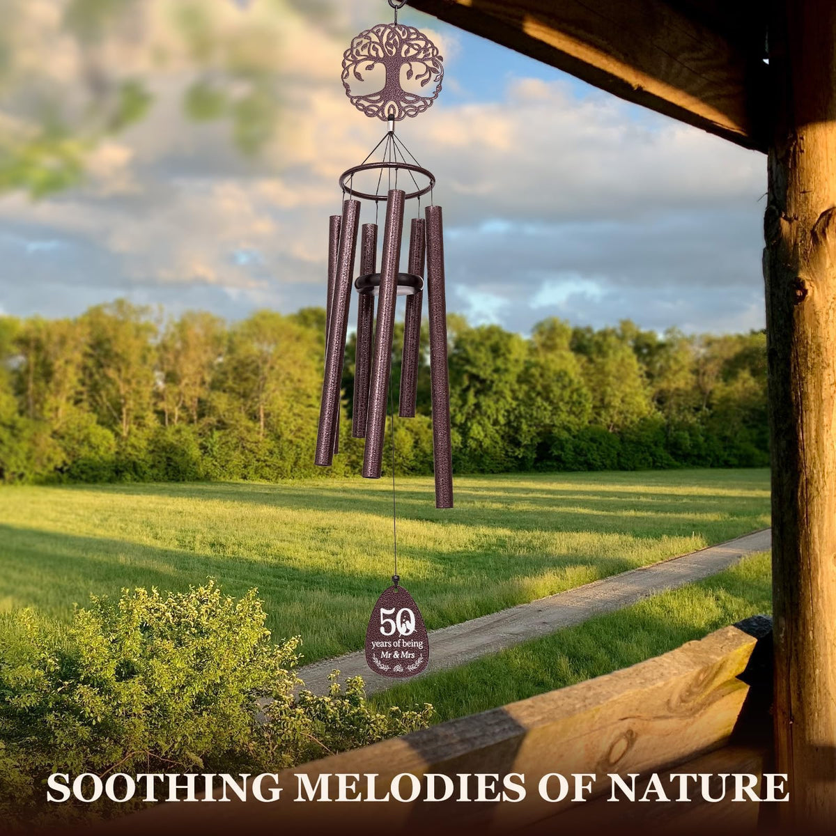 SteadStyle aluminum tree of life plaque complements garden celebrations.