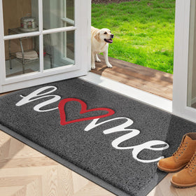 StepLively grey door mat greets guests at the front door with a durable, non-slip design.