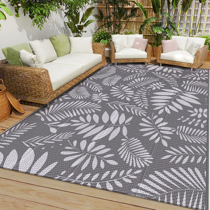 StepRite outdoor rug with banana leaf pattern offers durable waterproof performance for patios and decks.