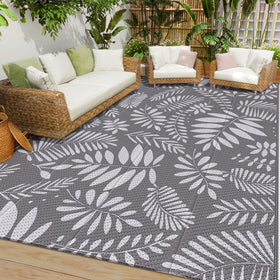 StepRite outdoor rug with banana leaf pattern enhances patio aesthetics and comfort