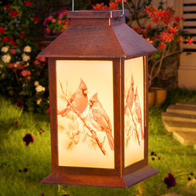 STF Cardinal Wind Chime in a cozy patio setting with warm glow.