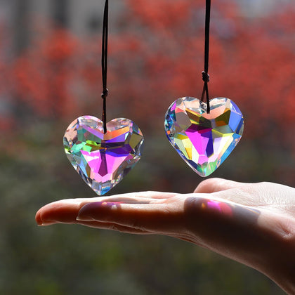 Stino geometry crystal suncatcher hanging in sunlight to create rainbow sparkles