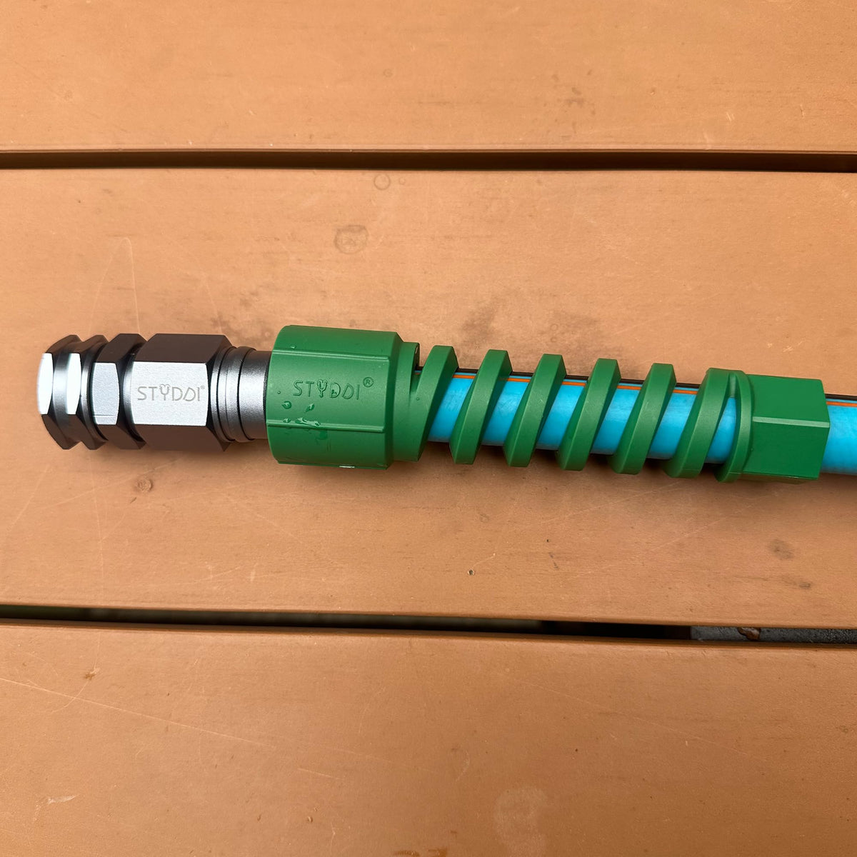 STYDDI bend-restrictor with plastic coil grip reduces sharp bends for smooth water flow