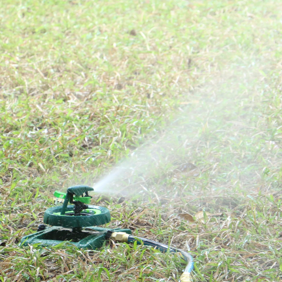 STYDDI Pattern Impulse Sprinkler close-up showing 12-point adjustment for distance control.