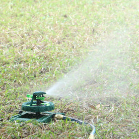 STYDDI Pattern Impulse Sprinkler close-up showing 12-point adjustment for distance control.