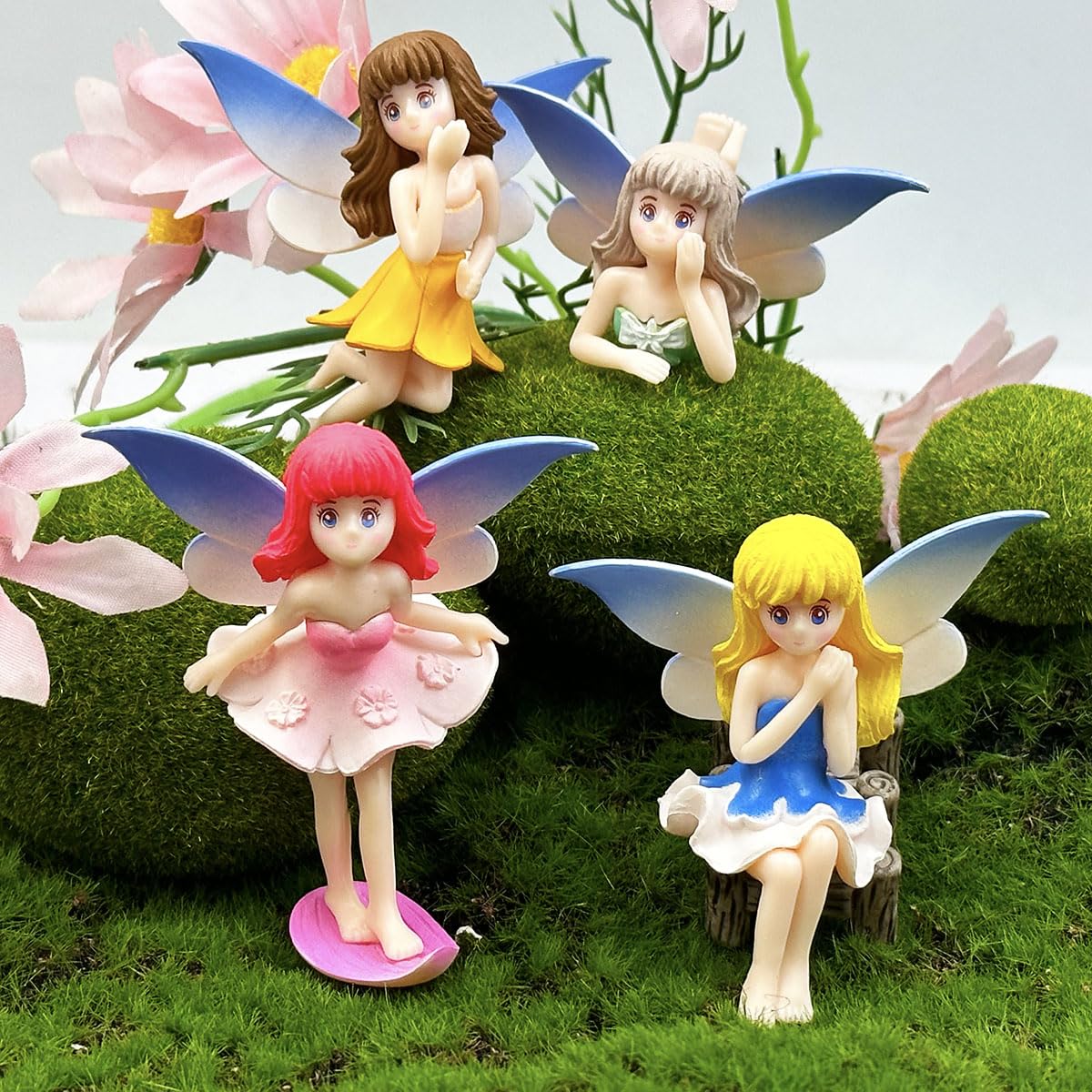 Suartus four-piece miniature fairy figurines set enhances garden scenes with playful color