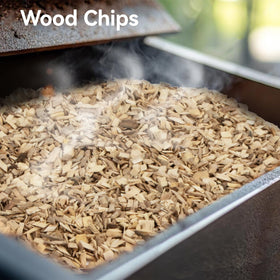 Sukh apple wood chips shown atop a smoker box for easy use.