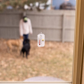 Sun Company Stickler compact 2.1 inch thermometer on a window