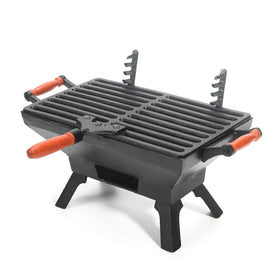 Sungmor compact cast iron grill on a table top, ideal for camping meals and small patios.