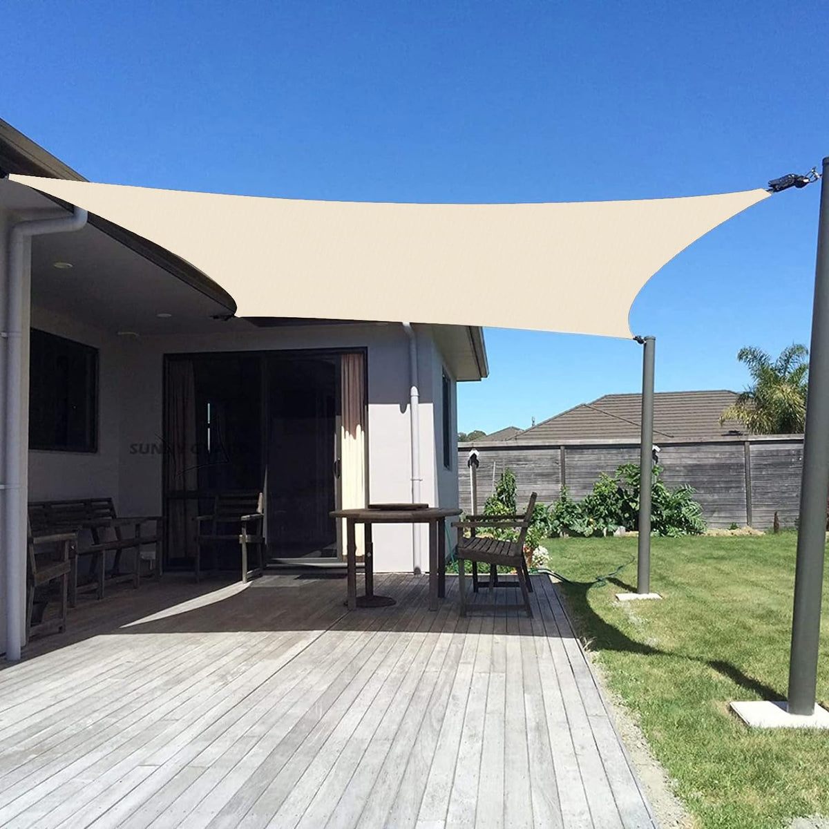 Sunny Guard sun shade sail butter cream over a patio providing sun protection