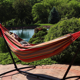 Sunnydaze double Brazilian cotton hammock sunset on stand demonstrates versatile outdoor lounging.