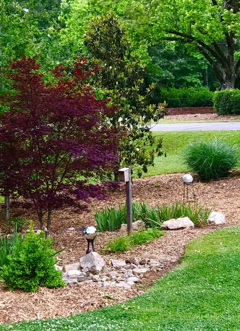Sunnydaze garden orb enhances outdoor spaces with reflective shine