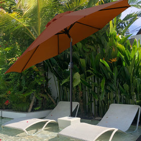 Sunnyglade umbrella shading a 42-54 inch table with seating for 4–6.