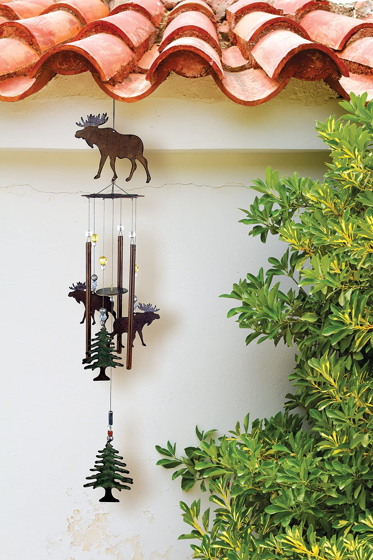 Sunset Vista Designs Wilderness Wonders wind chime hung outdoors provides gentle breeze melody.