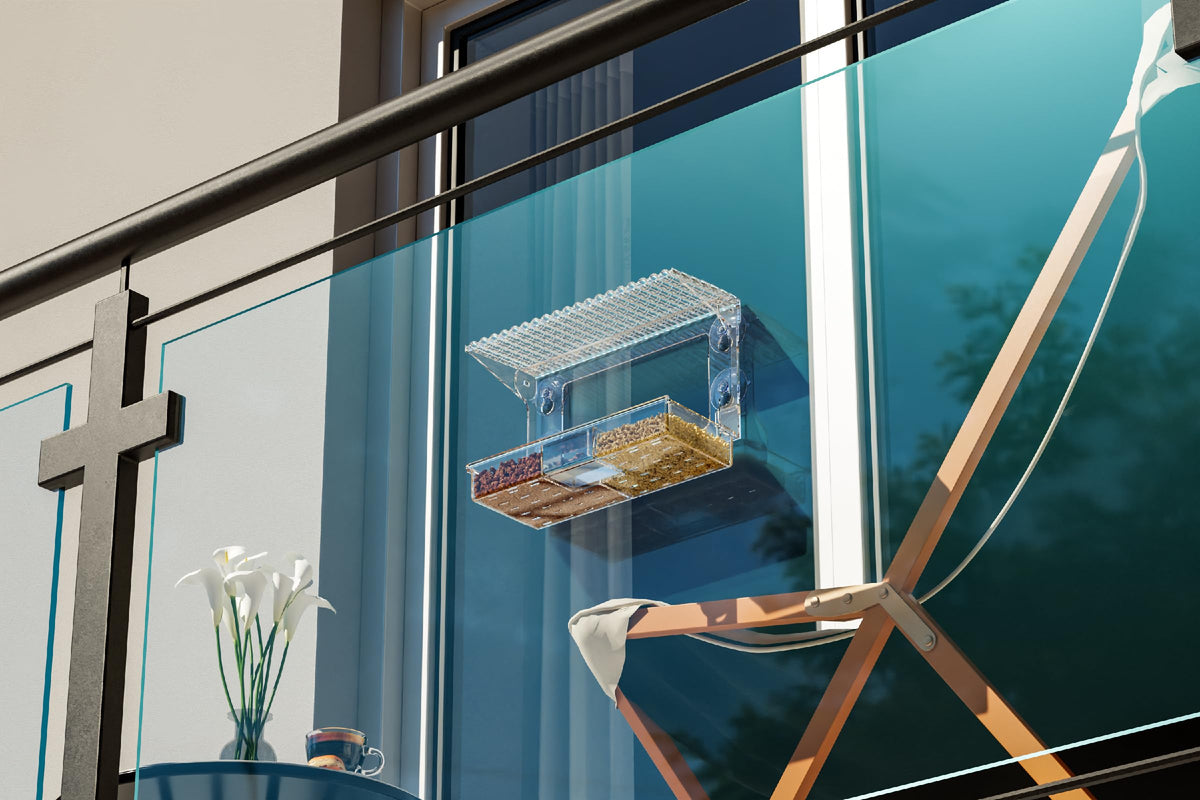 SuoXing Window Bird Feeder bottom tray with two compartments and drainage holes.