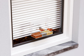 SuoXing Window Bird Feeder clear viewing through two-compartment tray for moisture control.