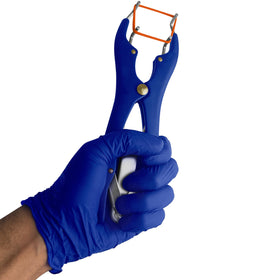 SURGICAL ONLINE goat banding kit in use by a farmer for lambs and piglets.
