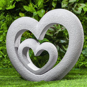 Suzile Nesting Heart Garden Sculpture centerpiece evoking enduring love for outdoor spaces