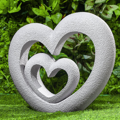 Suzile Nesting Heart Garden Sculpture centerpiece evoking enduring love for outdoor spaces