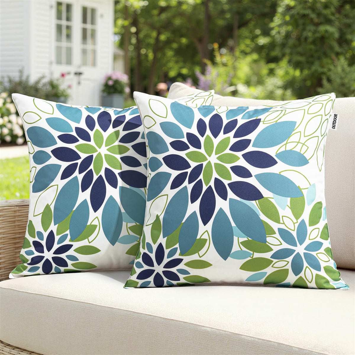 SWANCOCO floral outdoor pillow cover in blue-green provides waterproof protection for patio cushions.