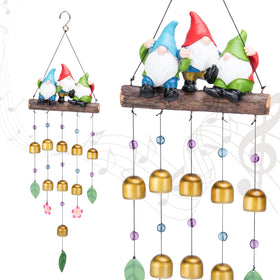 Taman gnomes wind chime on branches for a whimsical outdoor soundscape.