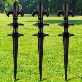 Tandefio Fleur de Lis garden hose guide stake keeping hoses neatly along borders.