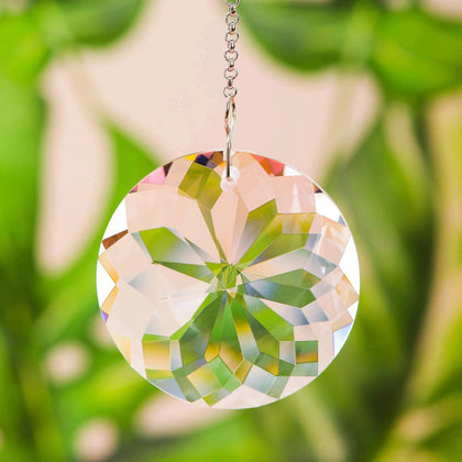 TANOMA Clear Glass Prism pendant casting vibrant rainbows in sunlit windows.