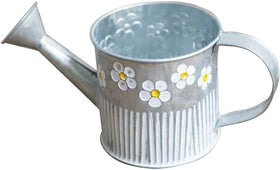 Taotenish daisy-embossed metal bucket planter on windowsill