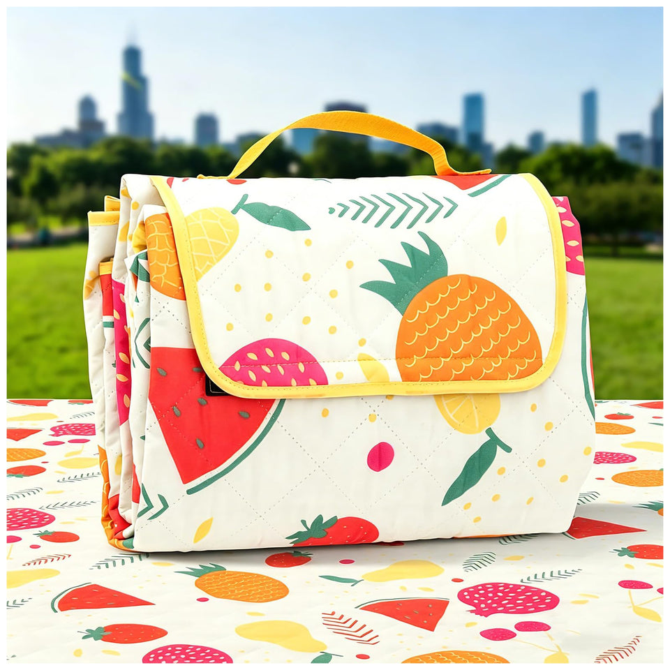 TaTalife picnic blanket 79x59 inches laid on grass for a family outdoor picnic.