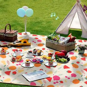 TaTalife picnic blanket with waterproof backing keeps moisture away on damp grass.